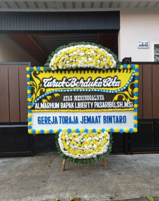 Papan Bunga Duka di Sawo
